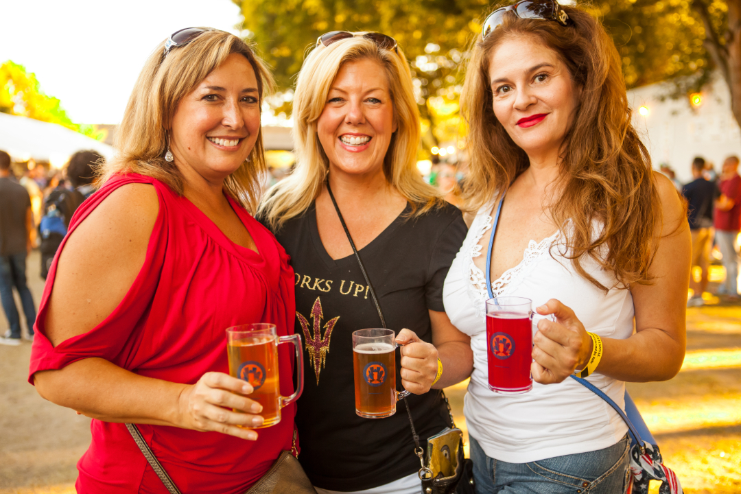 3 women enjoying beer at the event.
